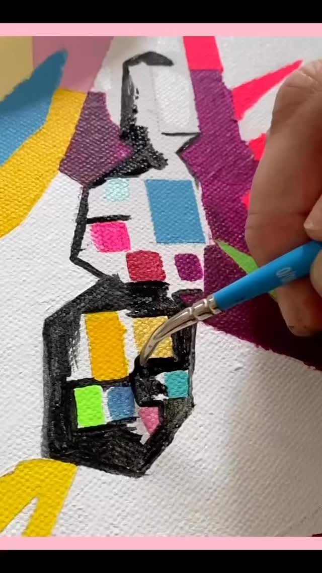 A brush adding bright color blocks to a small canvas